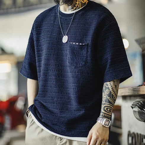Men’s Retro Indigo Jacquard T-Shirt with textured diamond pattern and front pocket.